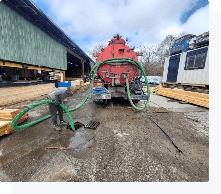 Clearset crew performing live hose setup and pump-out work on site.